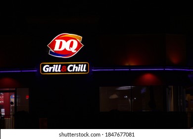 SAINT PETERS, MISSOURI - November 4, 2020: A Dairy Queen (DQ) Grill & Chill Store Front With The Sign Lit At Night.  Dairy Queen Is A Fast Food And Soft Serve Ice Cream Chain.