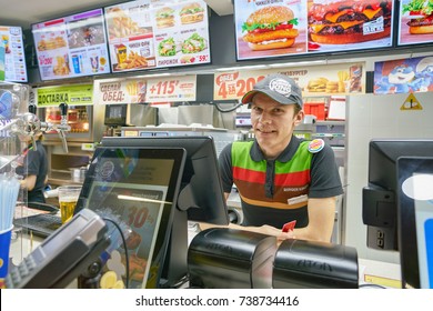 SAINT PETERSBURG - CIRCA SEPTEMBER, 2017: Indoor Portrait Of Worker At Burger King Restaurant. Burger King Is An American Global Chain Of Hamburger Fast Food Restaurants.