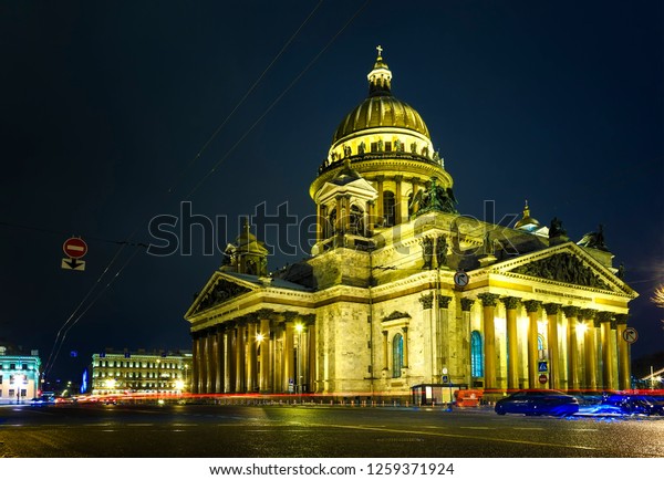 Saint Petersburg. Saint Isaac\'s\
Cathedral. night in Petersburg Night city. Streets in Petersburg.\
Russia. St. Isaac\'s Cathedral on background of blue\
sky.