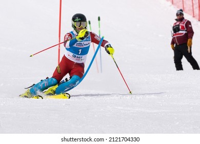Saint Petersburg mount skier Vorobev Denis skiing down mountain slalom ski slope. Russian Alpine Skiing Cup, International Ski Federation FIS Championship. Kamchatka Peninsula, Russia - March 28, 2019