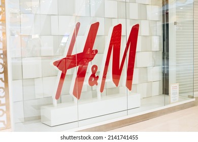 Saint Petersburg, Russia - 04.01.2022: Big Logo Of Hennes And Mauritz Or Hm Or H And M In Showcase Or Shop Window. Close-up.