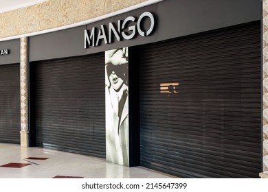 Saint Petersburg, Russia - 04.01.2022: Mango Is Closed In Shopping Mall Of St. Petersburg. Black Roller Shutter Door Or Curtain. Mango Store Suspends Work In Russia.