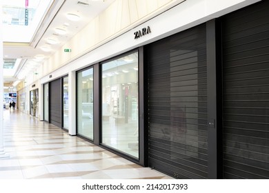 Saint Petersburg, Russia - 04.01.2022: Zara Is Closed In Shopping Mall Of St. Petersburg. Black Roller Shutter Door Or Curtain. Zara Store Suspends Work In Russia.