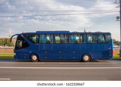 Saint Petersburg/ Russia - 10.09.2019: Modern Big Blue Bus Parked At The Side Of The Road On A City Background