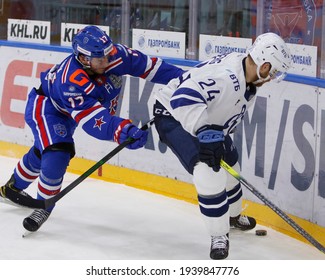 Saint Petersburg, Russia - 20 March 2021: Hockey. Gagarin Cup. KHL 2020-21 - SKA V Dynamo. The Player Of Hockey Club SKA Ivan Morozov (27), Oscar Lindbergh (24). 