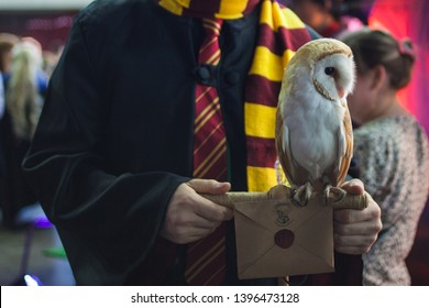 SAINT PETERSBURG, RUSSIA - APRIL 27, 2019: Owl and a letter to Hogwarts school of magic. Cosplayer Harry Potter