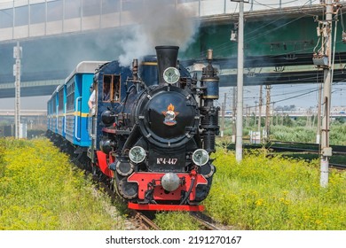 Saint Petersburg, Russia - August 06, 2022: Steam Train Of Childrens Railway Approaches To The Station.