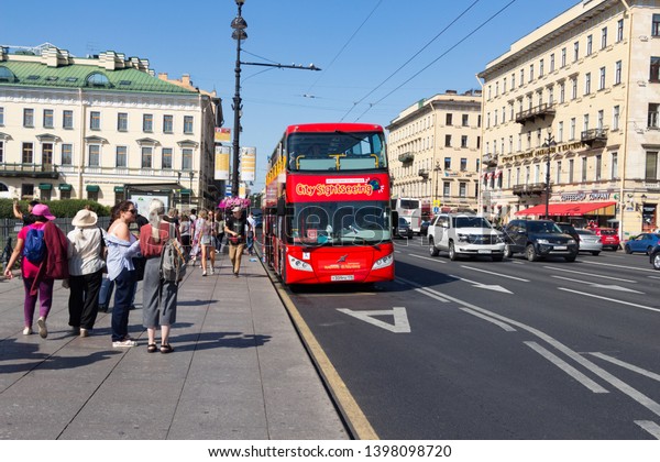 Saint Petersburg, Russia\
- August 10, 2018: The red excursion bus goes on the city street in\
the downtown