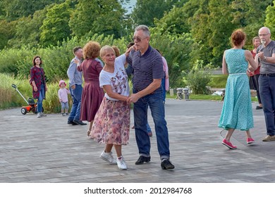 Saint Petersburg, Russia - August 15, 2020: Elderly people dancing in the city park of St. Petersburg