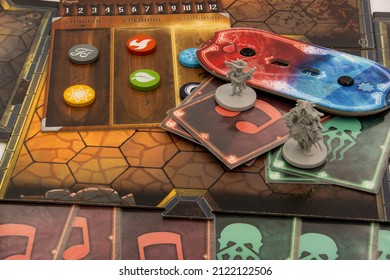 Saint Petersburg, Russia - February 11, 2022: Elements Of The Cooperative Board Game Gloomhaven. It Is A Campaign-based Dungeon Crawl Game With A Branching Narrative Campaign