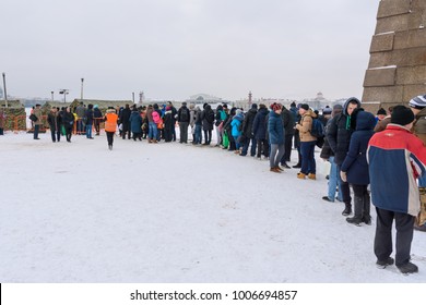 Saint Petersburg. Russia - January 12, 2018: Group Of People Standing In The Queue To Ice-hole For Bathing Into Cold Water On Epiphany Day. Traditional Ice Swimming In Orthodox Church