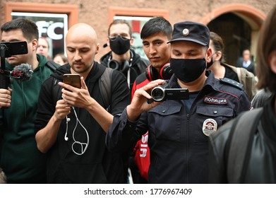 SAINT PETERSBURG, RUSSIA - July 15 2020: Same Work - Different Jobs. Journalists And Policeman With Cameras. Rally Against Russian Constitution Amendments