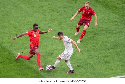 Saint Petersburg, Russia – July 2, 2021. Switzerland Players Denis Zakaria And Silvan Widmer Against Spain Midfielder Koke During EURO 2020 Quarterfinal Switzerland Vs Spain (1-1).