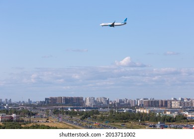 SAINT PETERSBURG, RUSSIA - JULY 24, 2021: Passenger Plane Of Pobeda Airlines Before Landing On The Pulkovo Airport