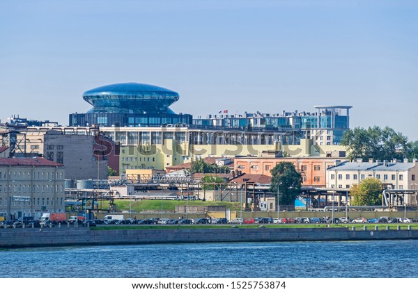 Saint Petersburg, Russia -  July 26, 2019:\
Sinopskaya Embankment of the River Neva with a prominent rooftop of\
the Committee for Science and Higher Education of the Government of\
St. Petersburg