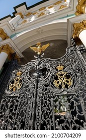 SAINT PETERSBURG, RUSSIA - JULY 7, 2021: Wrought iron gates to the Winter Palace (Hermitage) with a two-headed eagle symbol of Tsarist Russia