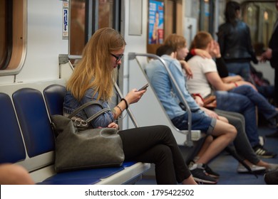 Saint Petersburg, Russia - June 26, 2016: Night subway train. Young people on their way home after a late city holiday. Facial fatigue after prolonged amusement and entertainment - Shutterstock ID 1795422502