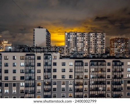 Saint Petersburg, Russia, october 5, 2023.  Multi-storey modern residential building at on the right bank of the Neva at sunrise time, fragment of facade