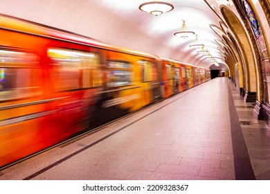 Saint Petersburg, Russia - September 23, 2017: Motion Blur Of Speedy Train In Underground Station With Bright Light, The Platform Is Empty After Passengers Get Inside The Train.