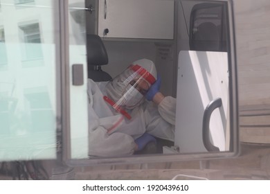 Saint Petersburg, Russia - September 30, 2020: A doctor in a protective white suit and a medical mask in a hospital during an epidemic - Shutterstock ID 1920439610