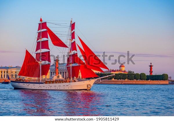 Saint Petersburg. Russia. Ship with scarlet sails\
on the background of Vasilievsky island. Brigantine with scarlet\
sails on the Neva. White nights in St. Petersburg. Holiday Scarlet\
sails.