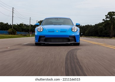 SAINT PETERSBURG, UNITED STATES - Jun 05, 2022: A Front View Of A Modern Blue Porsche 911 GT3 Sportscar In Motion