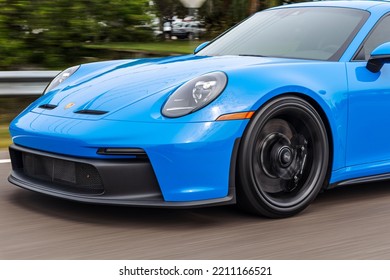 SAINT PETERSBURG, UNITED STATES - Jun 05, 2022: A Modern Blue Porsche 911 GT3 Sportscar In Motion On A Blurred Background