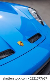 SAINT PETERSBURG, UNITED STATES - Jun 05, 2022: A Vertical Shot Of The Porsche Trademark On A Modern Blue 911 GT3 Sportscar