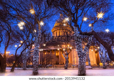 Saint Petersburg in winter. Russia Christmas evening. St. Isaac's Cathedral on Christmas night. Christmas holidays Saint Petersburg. New Year's Eve in Russia. Garlands in front of St. Isaac's place