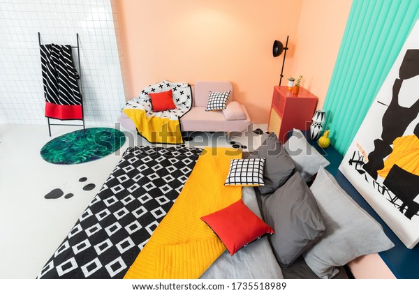 Saint Petersburg/Russia - March, 24\
2020: Living room interior in modern apartment with colorful\
furniture and textile, black and white printed details.\
