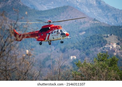 Saint Pierre, France - April 13th 2022 - Fire rescue helicopter bringing supplies to firefighters