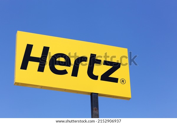 Saint Priest, France - June 18, 2017:\
Hertz logo on a panel. Hertz is an American car rental company with\
international locations in 145 countries\
worldwide