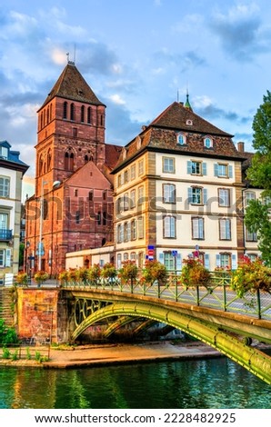Saint Thomas church and bridge across the Ill in Strasbourg, France