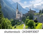 Saint Vincent Church in Heiligenblut town, famous tourist attraction in East Tyrol region in Alps. Grossglockner Mountain landscape