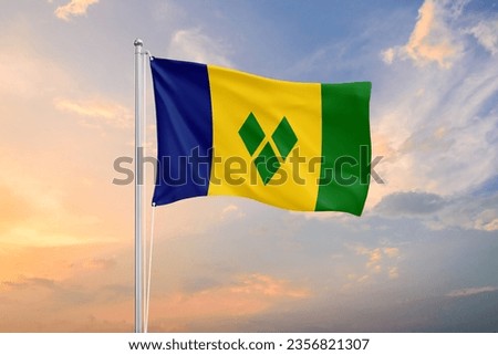 Saint Vincent and The Grenadines flag waving on sundown sky