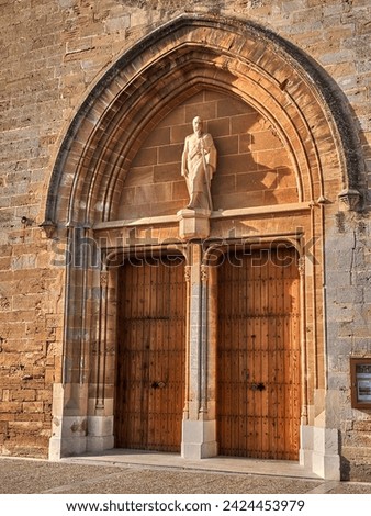 The saint welcomes parishioners at the entrance to the church