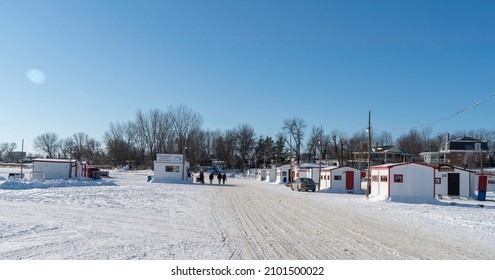 Sainte Anne De La Parade, Quebec  Canada - December 29 2021: A Makeshift Ice Fishing Community Forms On Riviere Sainte-Anne, Complete With Cabins, Rinks, Electricity, Shops, And Play Areas For Kids.