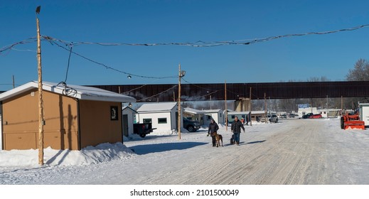 Sainte Anne De La Parade, Quebec  Canada - December 29 2021: A Makeshift Ice Fishing Community Forms On Riviere Sainte-Anne, Complete With Cabins, Rinks, Electricity, Shops, And Play Areas For Kids.