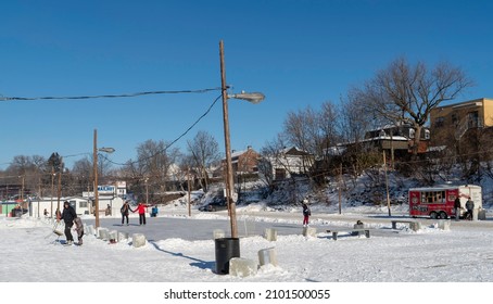 Sainte Anne De La Parade, Quebec  Canada - December 29 2021: A Makeshift Ice Fishing Community Forms On Riviere Sainte-Anne, Complete With Cabins, Rinks, Electricity, Shops, And Play Areas For Kids.