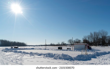 Sainte Anne De La Parade, Quebec  Canada - December 29 2021: A Makeshift Ice Fishing Community Forms On Riviere Sainte-Anne, Complete With Cabins, Rinks, Electricity, Shops, And Play Areas For Kids.