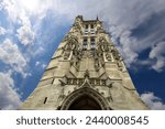 Saint-Jacques Tower (Tour Saint-Jacques) against the background of a beautiful sky with clouds. Located on Rivoli street, Paris, France. This 52 m Flamboyant Gothic tower (XVI century)    