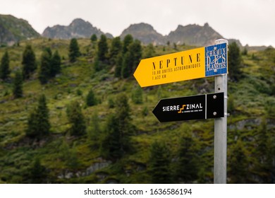 Saint-Luc, Valais, Switzerland - August 8 2018: Singpost With Directions For The Neptune Statue On The Planets Trail And For The Sierre Zinal Race