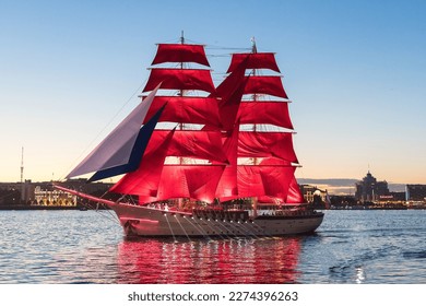 Saint-Petersburg. Holiday of Scarlet Sails. Russia. A sailboat sails on the Neva. Annual alumni celebration. Miracle night show on the Neva River in St. Petersburg, romantic ship with scarlet sails