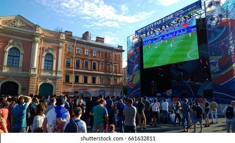 Saint-Petersburg, Russia - 18 June, 2017: Football fans in the fan zone of the city of St. Petersburg watch the match on the big screen
