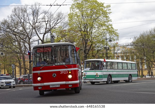 SAINT-PETERSBURG, RUSSIA - 21 MAY\
2017: Historical Soviet bus. Parade of vintage cars. Tinted\
photo.