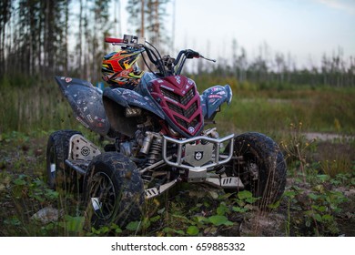 SAINT-PETERSBURG, RUSSIA - AUGUST 2015: ATV Yamaha Raptor R700 With Halmet On It, In The Forest.