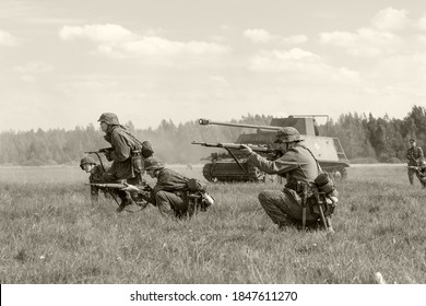 SAINT-PETERSBURG, RUSSIA - AUGUST, 22, 2020: Historical re-enactment of the battlefield, soldiers fighting during World War II. Military reconstruction, black and white image

