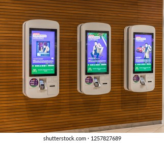 Saint-Petersburg / Russia - December 3 2018: McDonald's Self-ordering Machines With Monopoly Game On Its Displays. Fast Food Restaurant