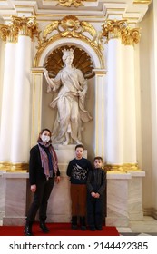Saint-Petersburg, Russia. January 7, 2022. Editorial Use Only. Mother with sons on the Jordan stairs in the State Hermitage.