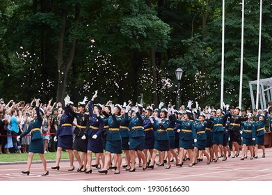 SAINT-PETERSBURG, RUSSIA - JUNE 21 2019: Female Students Of A Military Academy Graduation Ceremony, Throwing Flower Petals In Air